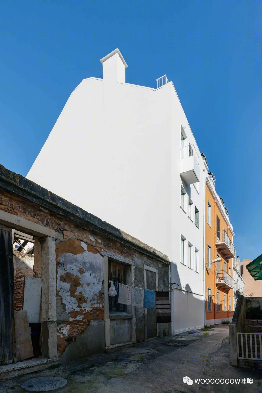 里斯本 Rua Bartolomeu Dias 住宅,翻新扩建的现代魅力-7
